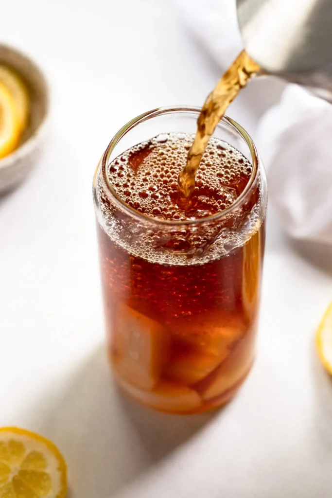 cup of iced tea being poured